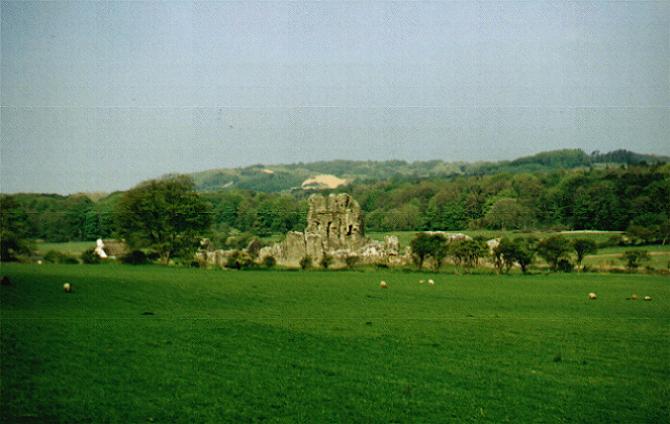 Ogmore Castle from road with Merthyr Mawr sand dunes in distance
