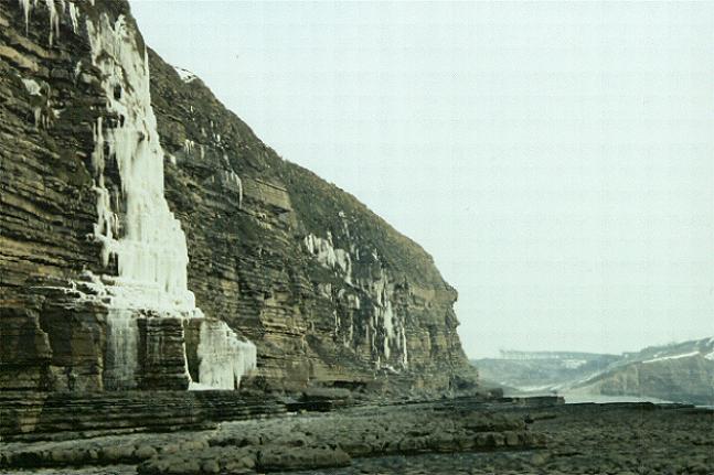 Water frozen on cliffs at Southerndown beach, looking towards Dunraven Park